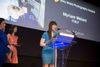 Myriam Meloni receiving her award for Arts and Culture.