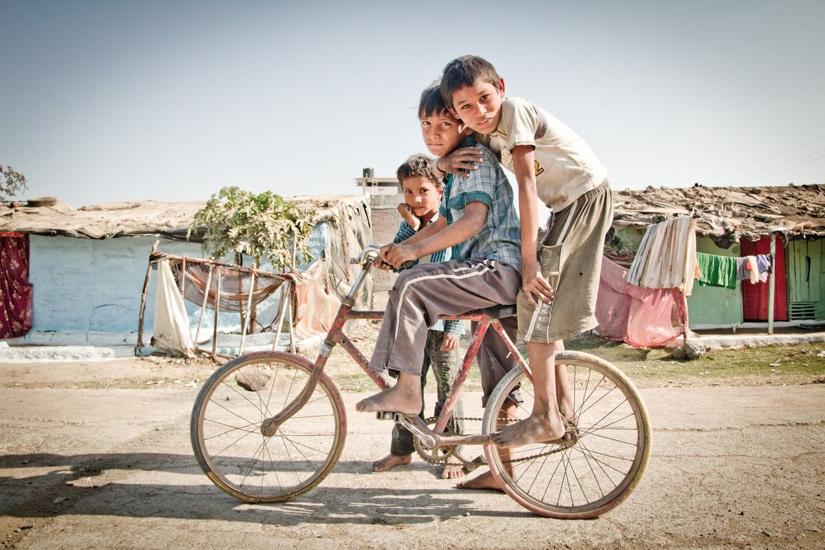 Three Kids on a bike -  Bhopal, India